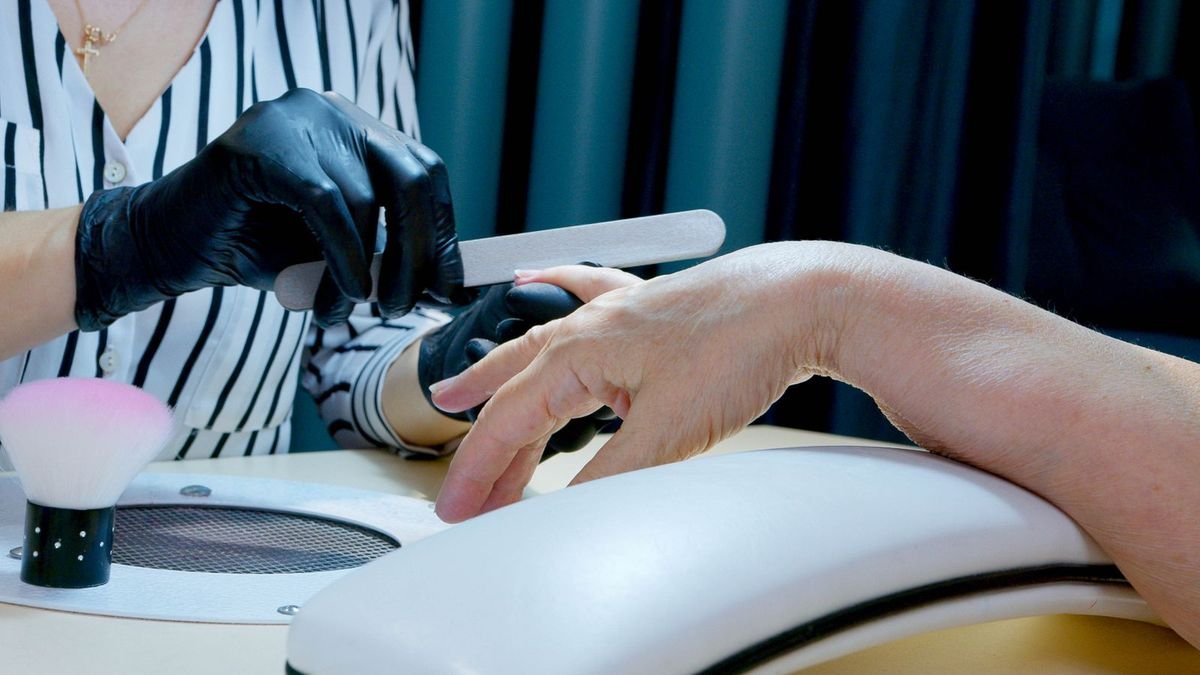 Nail care during a salon BIAB manicure appointment