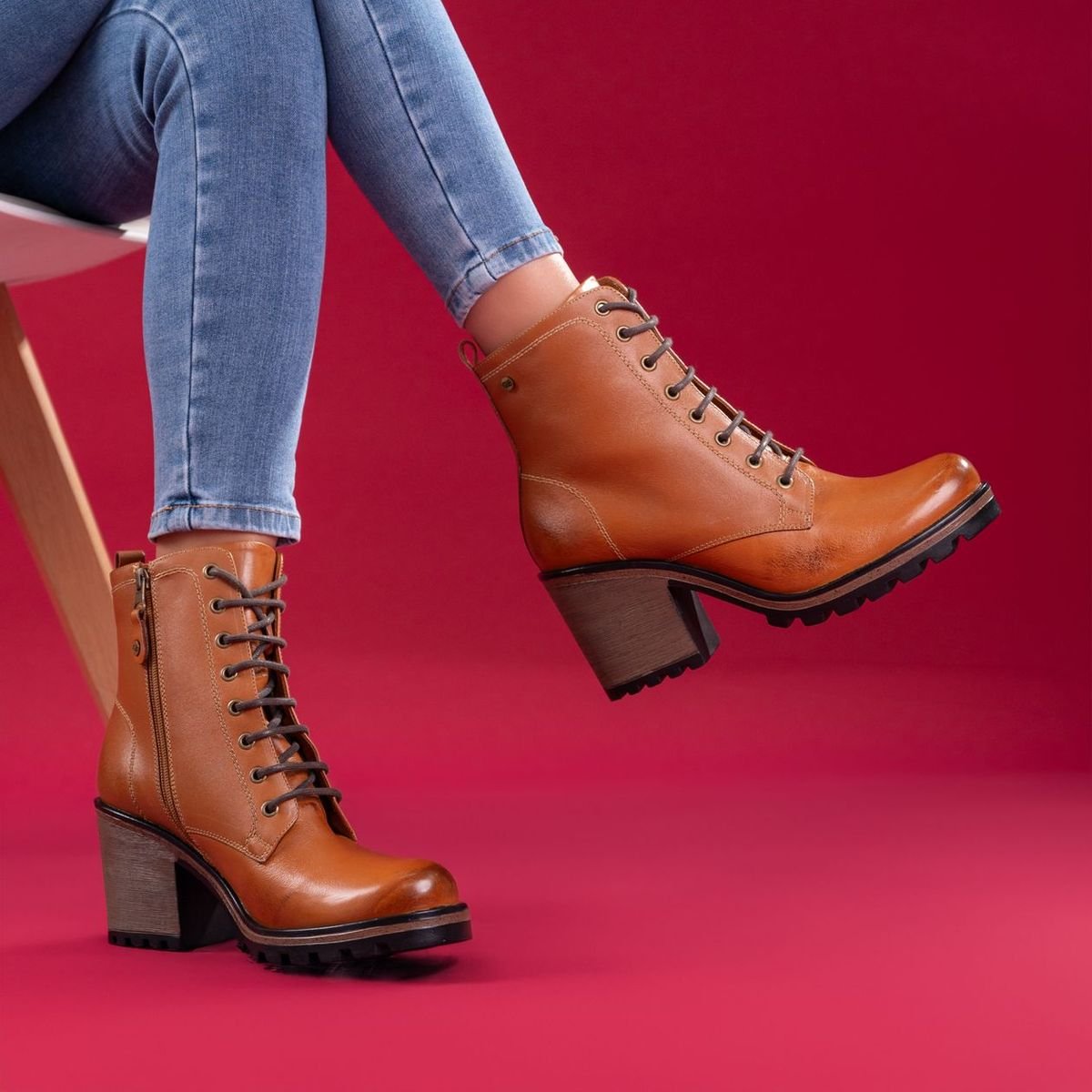 Brown boots worn with blue jeans for a casual autumn outfit