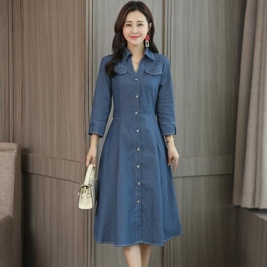 Woman wearing a date night denim shirt dress with a handbag