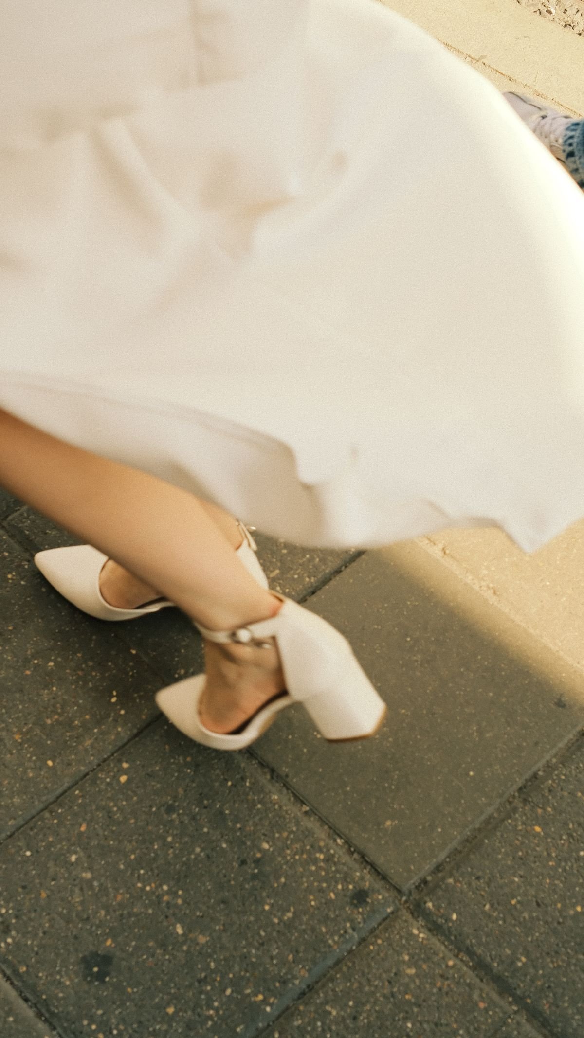 Woman walking in low heels with an evening outfit