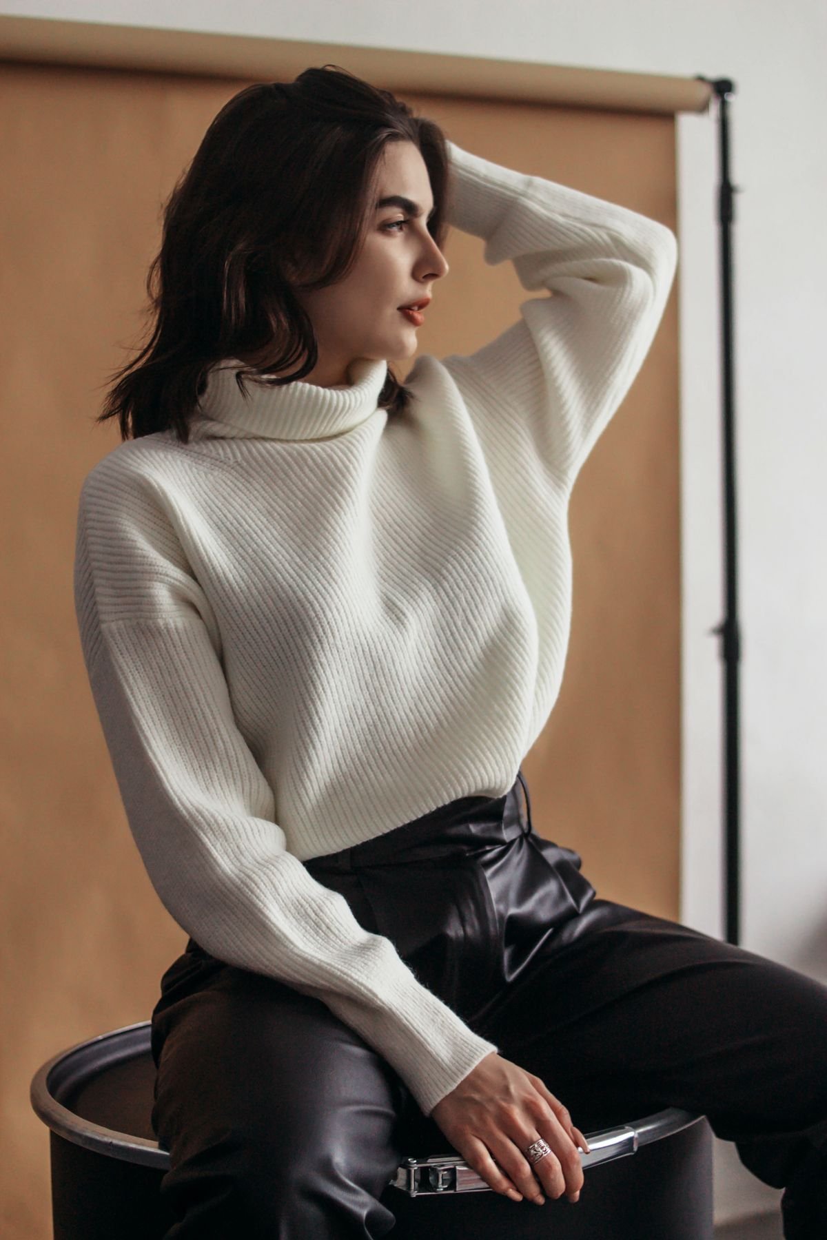 Knit co-ord outfit styled for work with a tailored coat and smart shoes