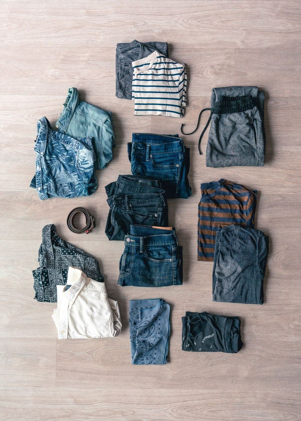 Folded clothes flat lay in one blue colour story showing how to match colours in an outfit