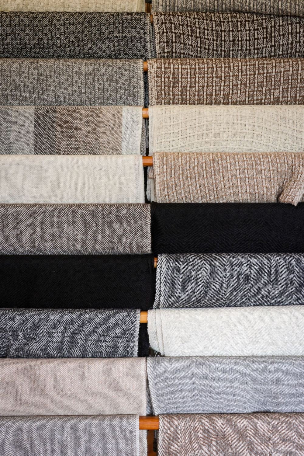 Neutral fabric colours in grey, beige and black for building a seasonal colour palette wardrobe