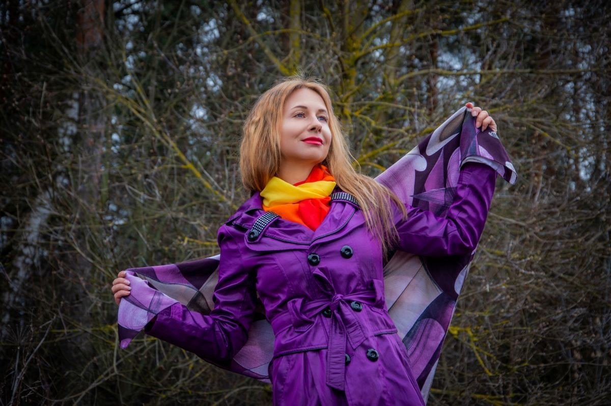 Royal purple wool coat worn as a statement over black
