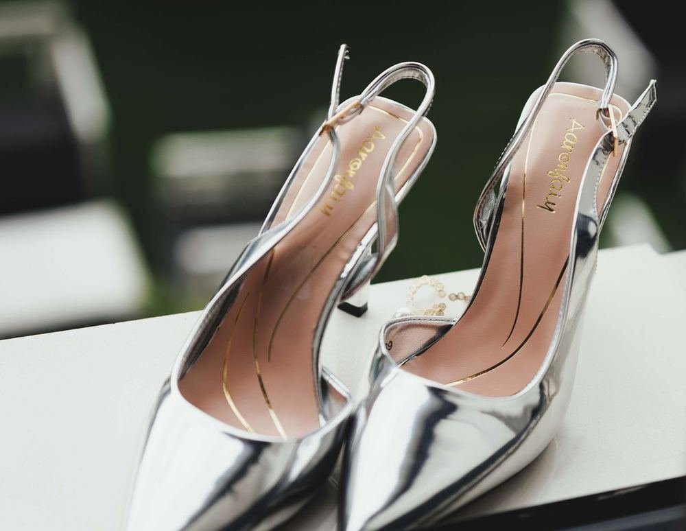 Silver stiletto wedding heels where accurate UK US EU shoe size conversion prevents a painful fit